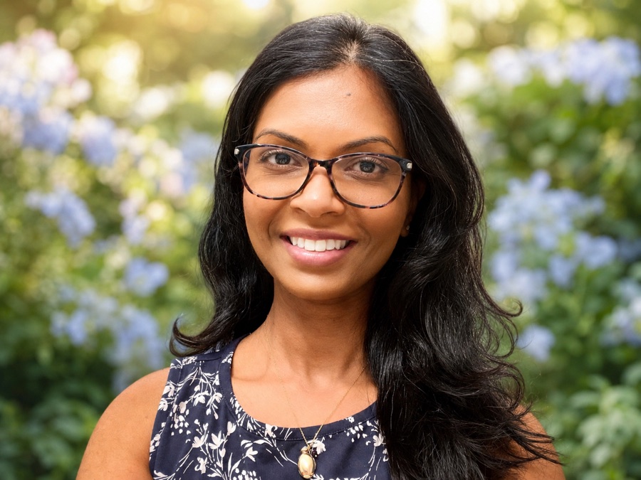 Dr. Nelly Singh, DO, smiling outdoors