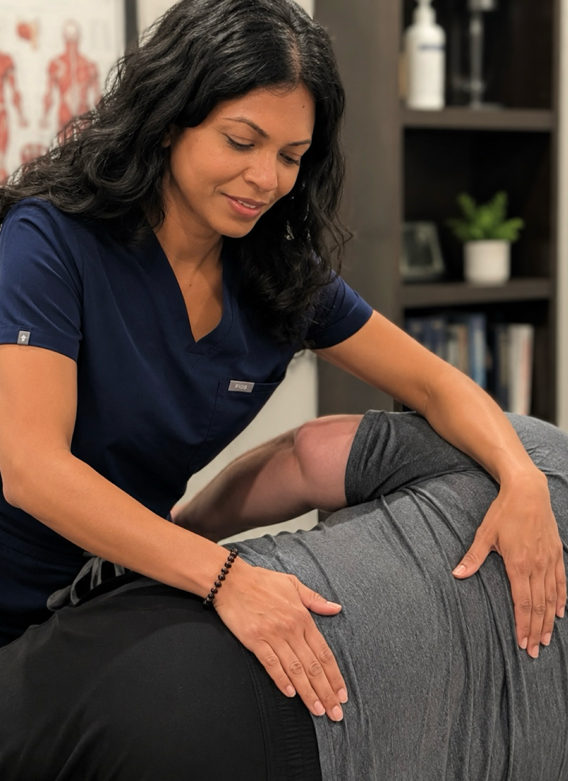 Dr. Nelly Singh, DO performing paraspinal soft tissue osteopathic treatment